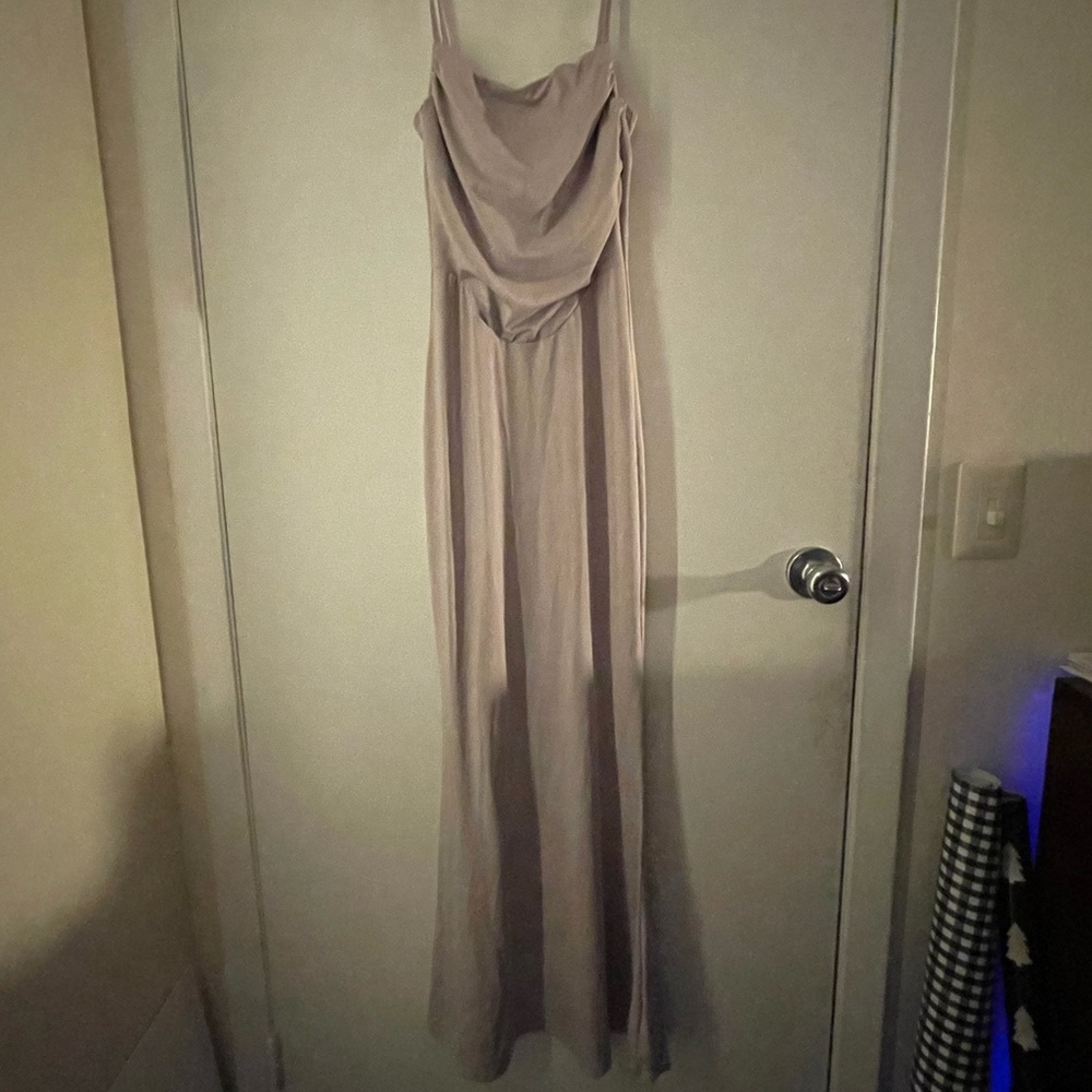 Pale pink long dress. Has a corset top and spaghetti straps.